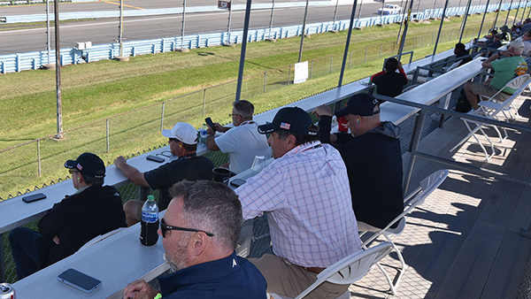 Fans enjoying view from Turn 1 Patio