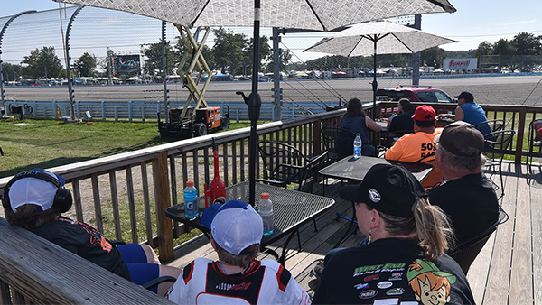 Fans enjoying patio view from Wedgewood Suites Hospitality