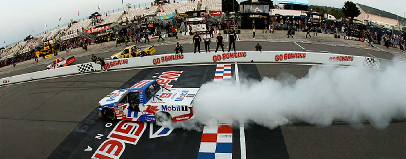 WATKINS GLEN, NEW YORK - AUGUST 08: Corey Heim, driver of the #11 Mobil 1 Toyota, celebrates with a burnout after winning the NASCAR Craftsman Truck Series Mission 176 at The Glen at Watkins Glen International on August 08, 2025 in Watkins Glen, New York. (Photo by Sean Gardner/Getty Images)